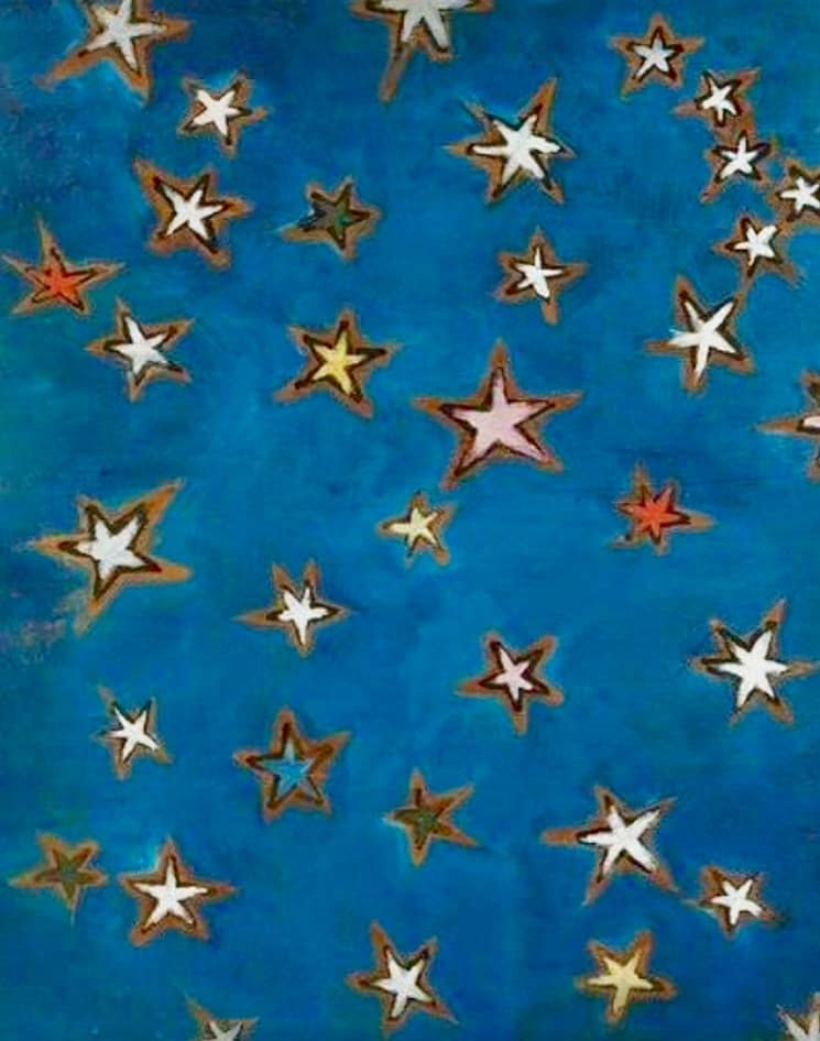 Estrellas de colores sobre fondo azul